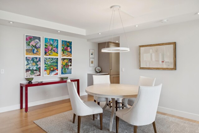 dining room with hardwood / wood-style floors