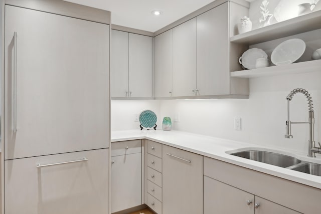 kitchen featuring sink and white fridge