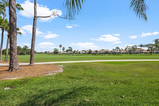 surrounding community featuring a yard