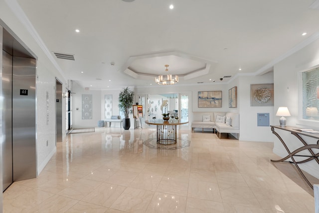 interior space featuring a notable chandelier, light tile patterned floors, a tray ceiling, elevator, and ornamental molding