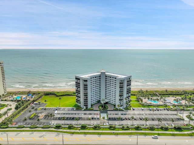 bird's eye view with a water view and a view of the beach