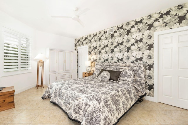 tiled bedroom with a closet and ceiling fan