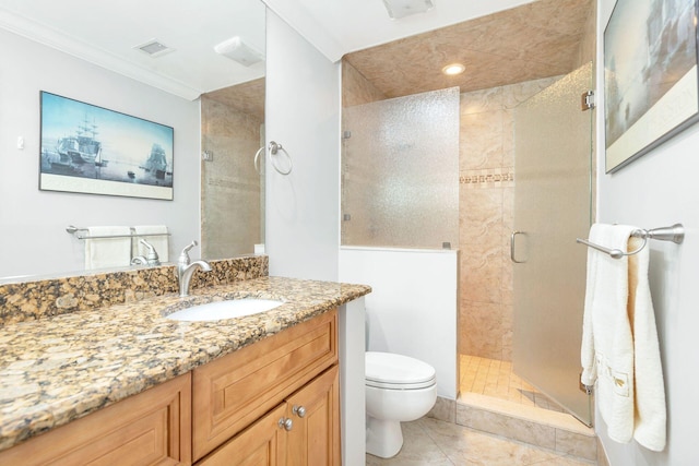 bathroom featuring vanity, toilet, crown molding, and a shower with door