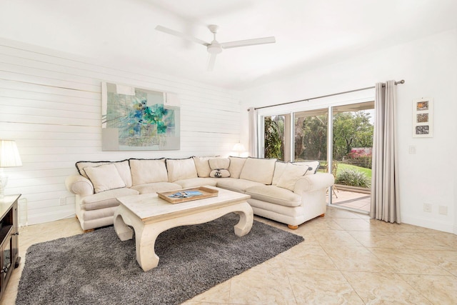 living room featuring ceiling fan and light tile floors