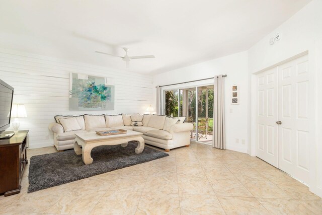 kitchen with kitchen peninsula, light tile floors, tasteful backsplash, and appliances with stainless steel finishes