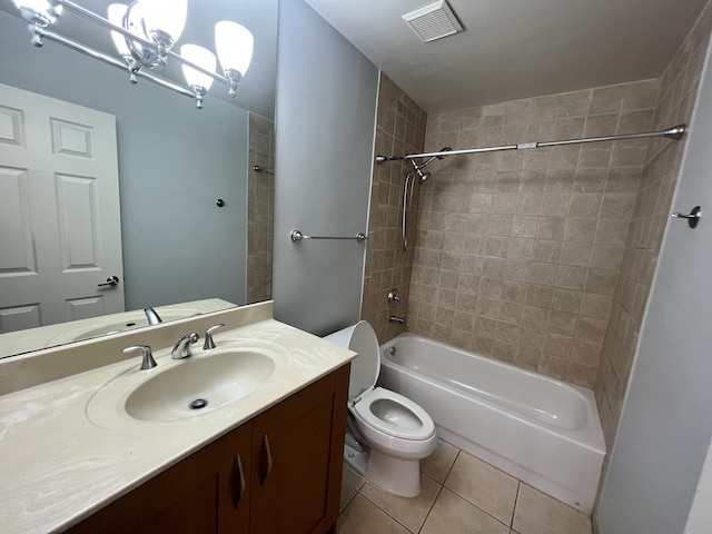 full bathroom with tiled shower / bath combo, tile patterned flooring, a chandelier, toilet, and vanity