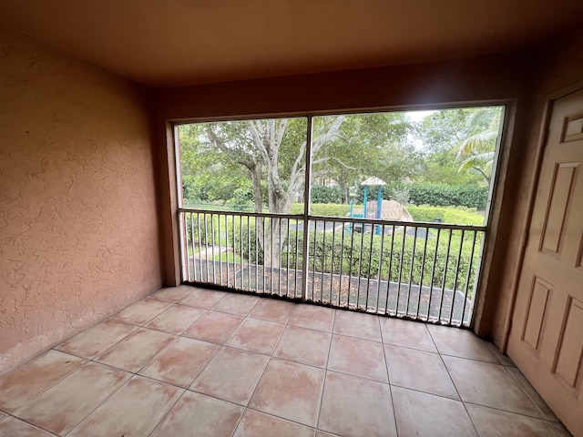 unfurnished sunroom with a wealth of natural light