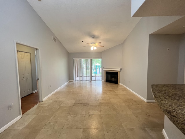 unfurnished living room with ceiling fan