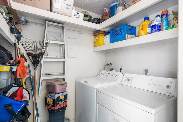 clothes washing area with a textured ceiling and washing machine and clothes dryer