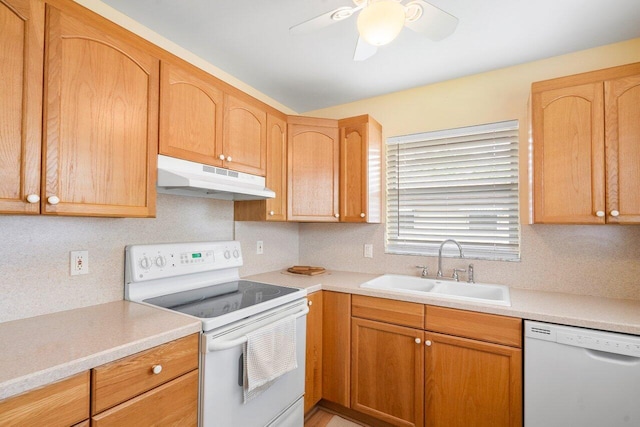 kitchen with white appliances, ceiling fan, and sink