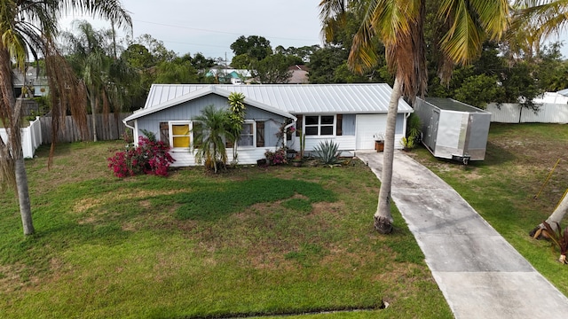 ranch-style house with a shed and a front lawn