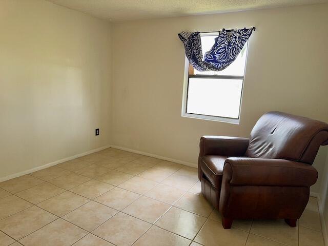 living area with light tile patterned floors