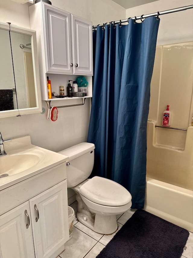 full bathroom featuring toilet, vanity, shower / bathtub combination with curtain, and tile patterned floors