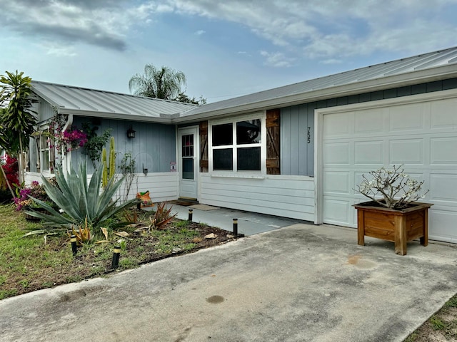 ranch-style house featuring a garage