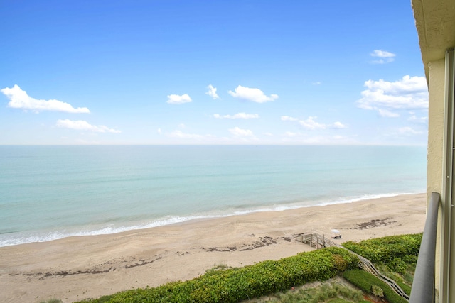 view of water feature with a beach view