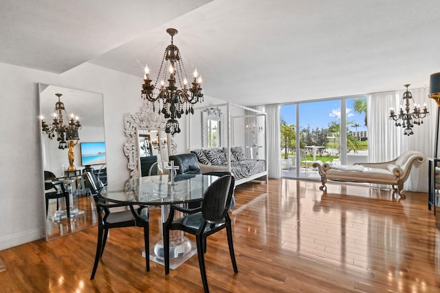 dining space with a chandelier and hardwood / wood-style flooring