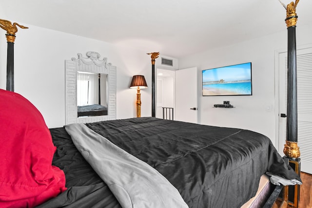 bedroom with hardwood / wood-style floors