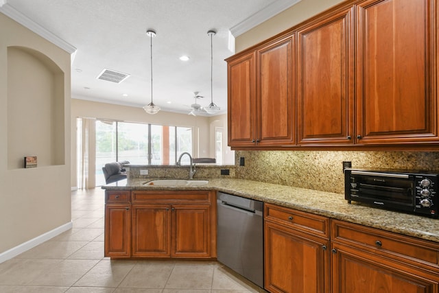 kitchen featuring visible vents, hanging light fixtures, stainless steel dishwasher, a sink, and a peninsula