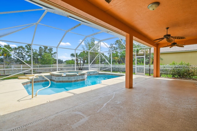 view of swimming pool featuring a ceiling fan, a patio, a fenced backyard, a lanai, and a pool with connected hot tub