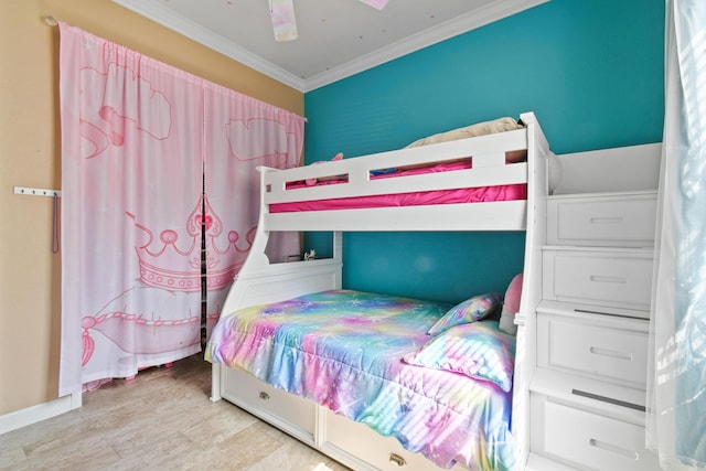 bedroom featuring ornamental molding, a ceiling fan, and baseboards