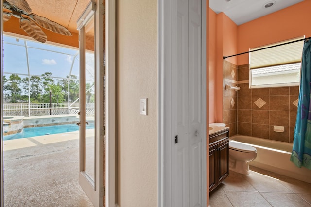 full bath with shower / tub combo, vanity, toilet, and tile patterned floors