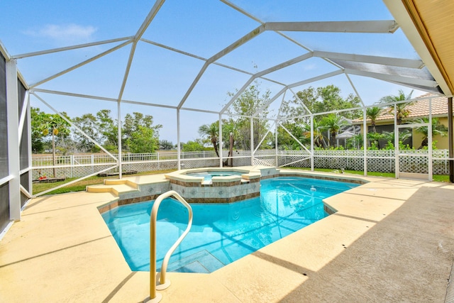 view of swimming pool with a lanai, a patio area, a pool with connected hot tub, and a fenced backyard