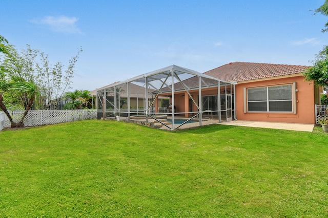 back of house featuring a patio, a fenced backyard, a lanai, a tiled roof, and a fenced in pool