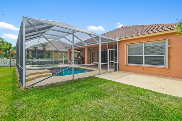 back of property with a fenced in pool, a tiled roof, a lanai, a yard, and a patio area