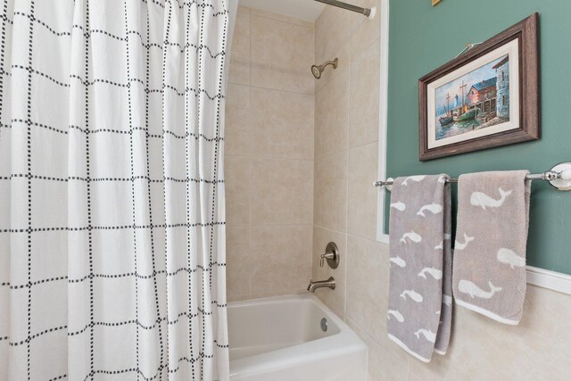 bathroom featuring shower / bathtub combination with curtain