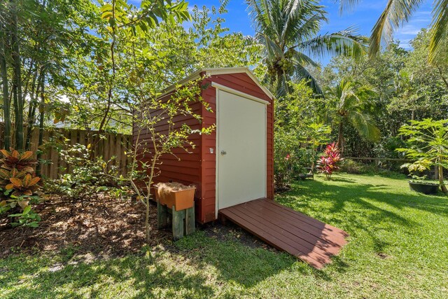 view of outdoor structure with a lawn