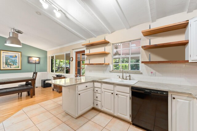 kitchen with tasteful backsplash, light wood-type flooring, lofted ceiling with beams, black dishwasher, and white cabinetry