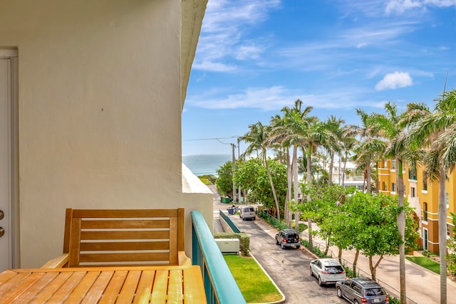 balcony featuring a water view