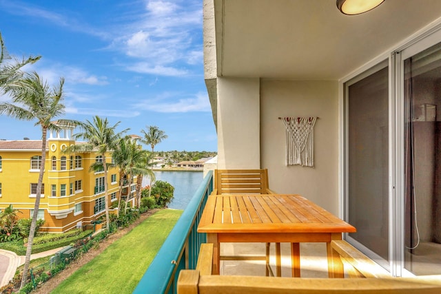 balcony featuring a water view