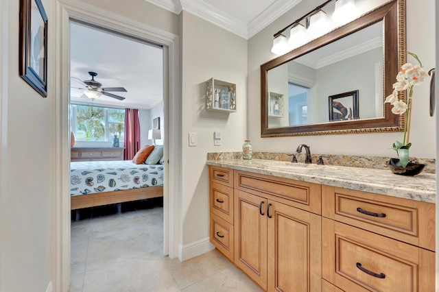 bathroom with ceiling fan, vanity, crown molding, and tile patterned flooring