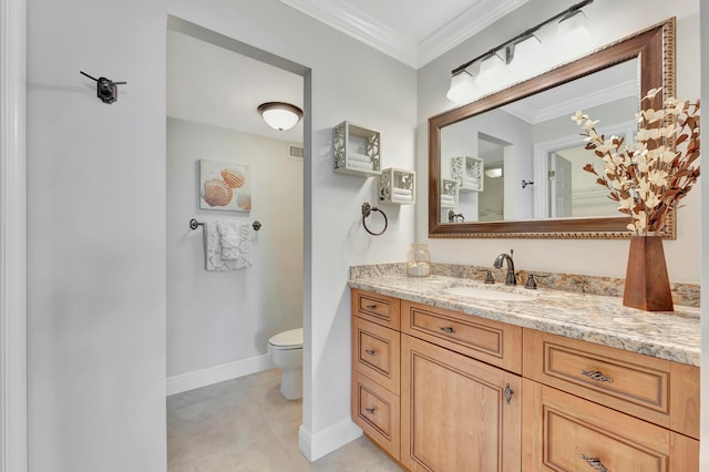 bathroom featuring vanity, crown molding, toilet, and tile patterned floors