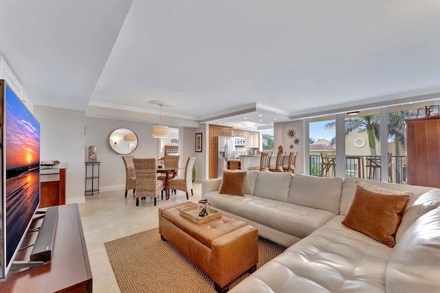 tiled living room featuring crown molding