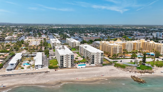 bird's eye view with a water view and a view of the beach