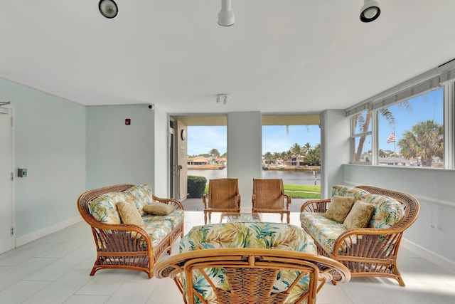 sunroom with a water view