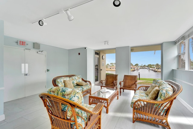 interior space with track lighting and a water view