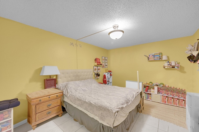 bedroom featuring a textured ceiling and light tile patterned floors