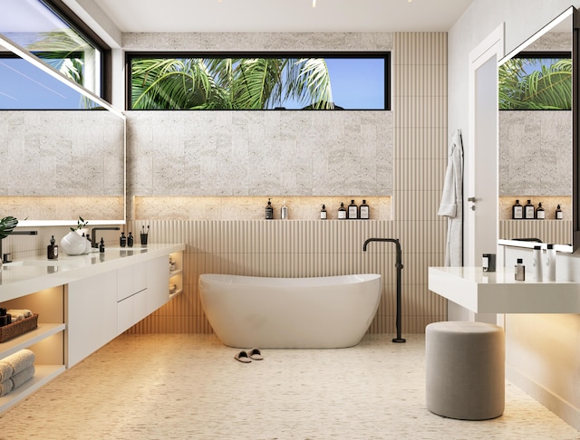 bathroom with vanity and a tub