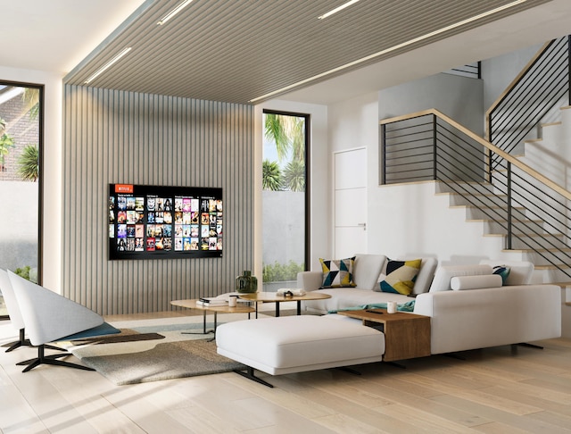 living room with light hardwood / wood-style flooring and expansive windows