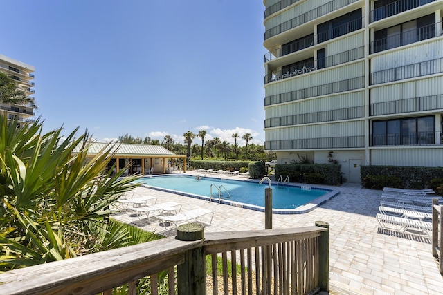 view of swimming pool featuring a patio area