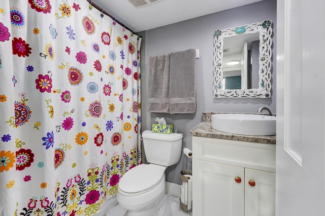 bathroom with vanity, toilet, and walk in shower