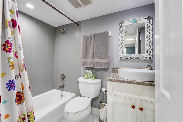 full bathroom with vanity, toilet, and shower / tub combo with curtain