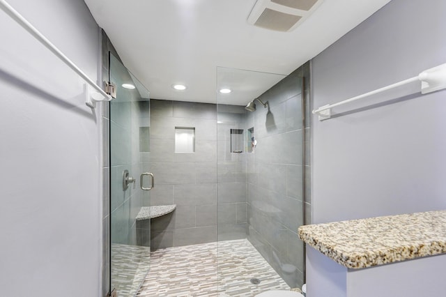 bathroom featuring an enclosed shower