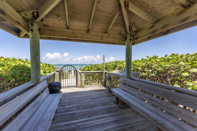 wooden deck featuring a gazebo and a water view