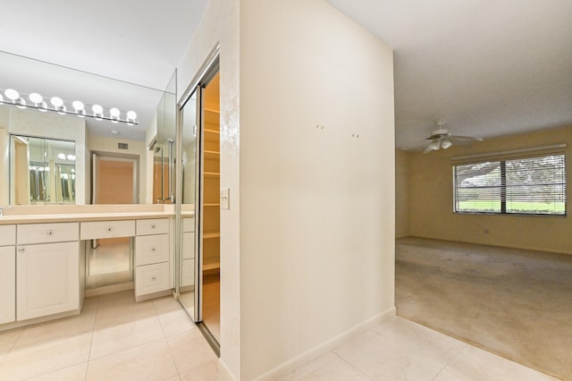 bathroom with vanity, ceiling fan, and tile patterned floors