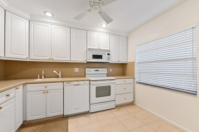 kitchen featuring sink, white cabinetry, white appliances, and ceiling fan