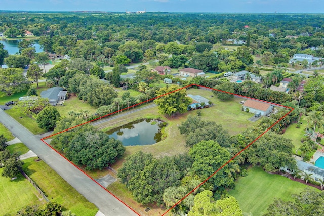 bird's eye view with a water view